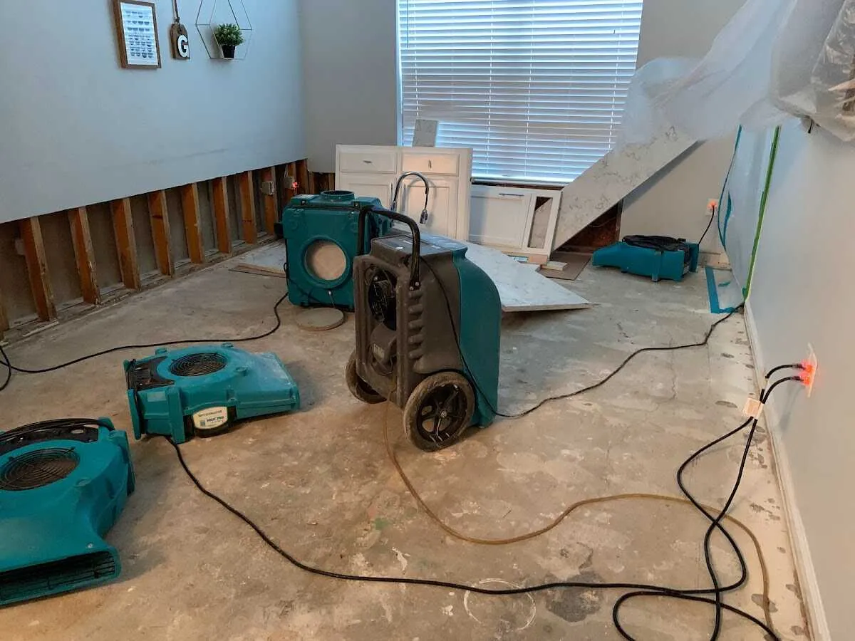 Dehumidifier in flood-cut room for Water Damage Restoration in Orange